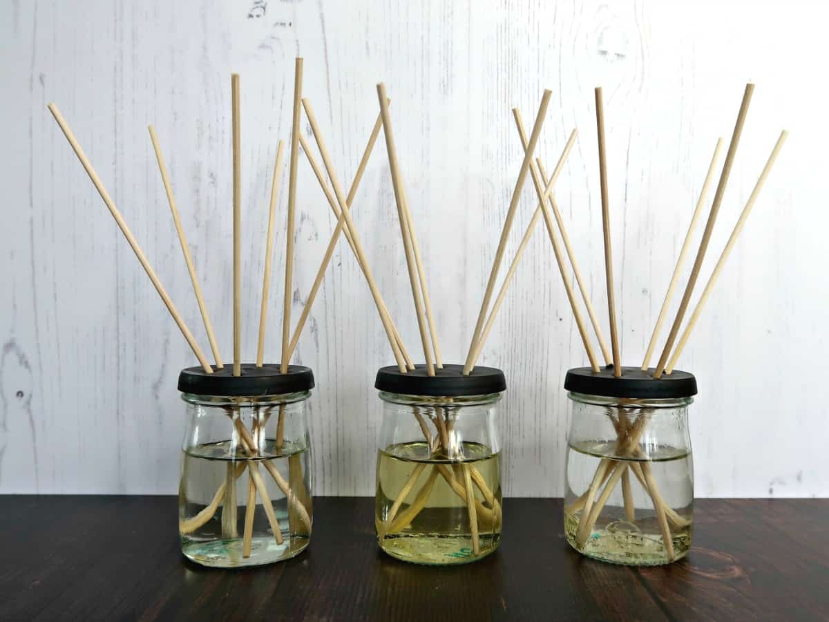 Love Reed Diffusers but not the price? We test 3 homemade reed diffuser oil recipes to find out which works best, and if any of them are as good as the expensive ones you see in the shops. #essentialoils #homefragrance #reeddiffuser airfreshener #DIYReedDiffuser