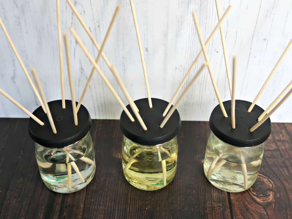 Love Reed Diffusers but not the price? We test 3 homemade reed diffuser oil recipes to find out which works best, and if any of them are as good as the expensive ones you see in the shops. #essentialoils #homefragrance #reeddiffuser airfreshener #DIYReedDiffuser
