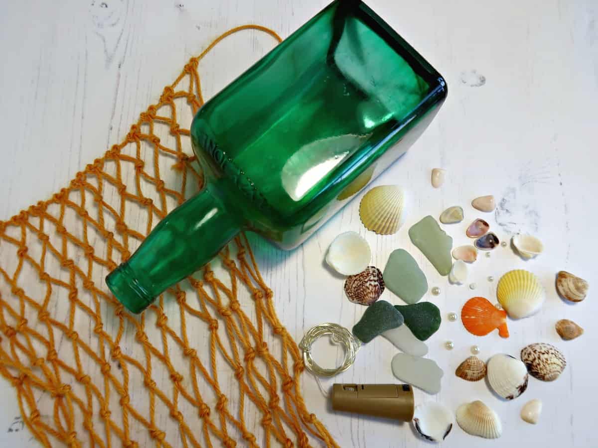 In this tutorial, I show you how to make tinted glass easily at home using Bostik PVA Glue. Before turning our pretty coloured glass into a beach themed light up bottle. #SeaGlass #ColouredGlass #TintedGlass #LEDLights #BottleLight #WineBottle #WineBottleUpcycle #BostikCrafts
