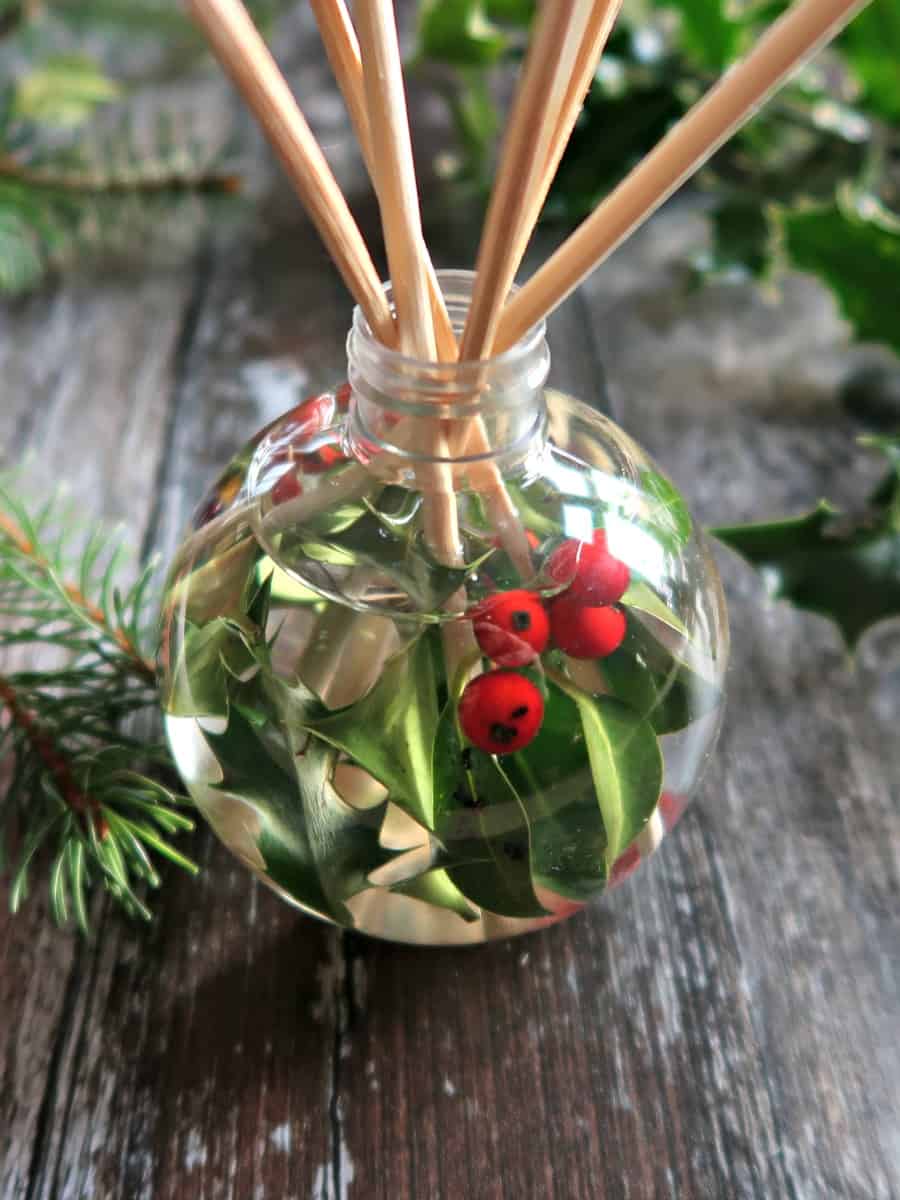 These Christmas reed diffusers use fillable Christmas baubles as diffuser bottles and Christmassy essential oils for fragrance.