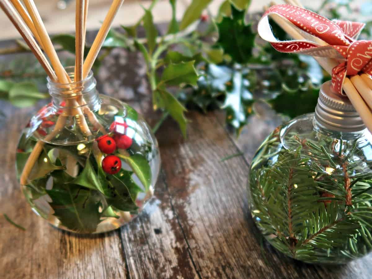 These Christmas reed diffusers use fillable Christmas baubles as diffuser bottles and Christmassy essential oils for fragrance.