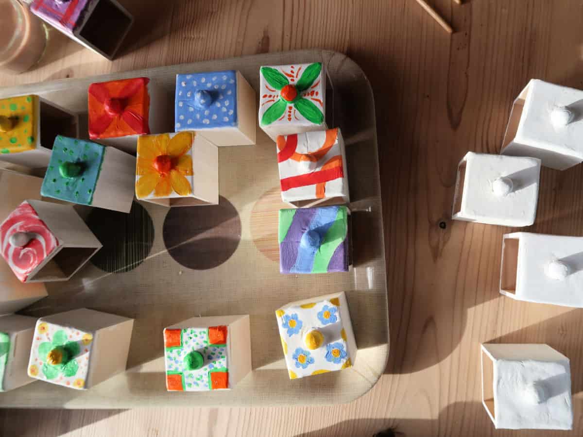 DIY Spice Chest made from an advent calendar box and air-dried clay. This easy craft tutorial turns a plain wooden advent calendar box into a gorgeous spice chest with clay fronted drawers decorated with acrylic paints. Perfect for holding spices or little knick-knacks.